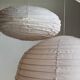 Average suspension in natural rattan and linen, Japanese-style, flattened oval in pink.
