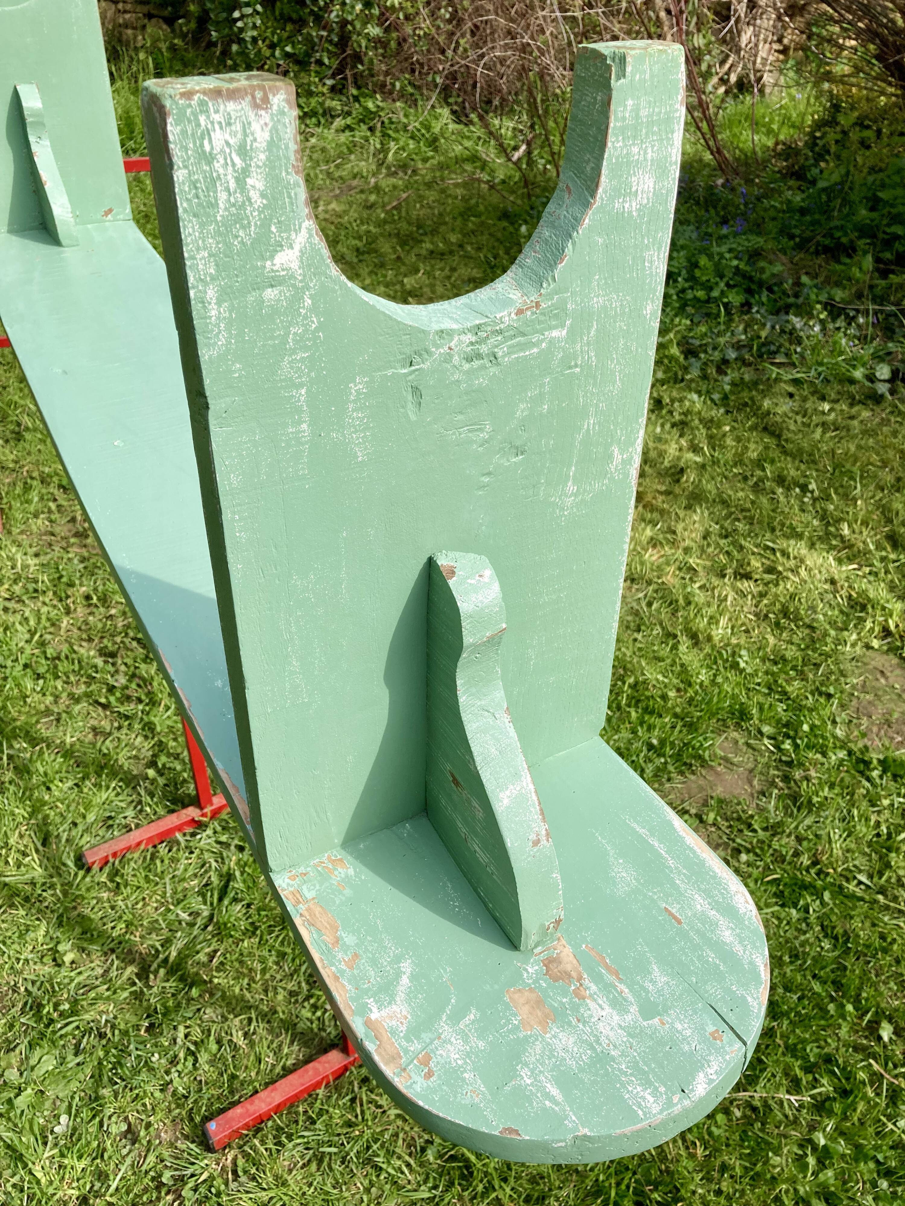 Old curved wooden farm bench