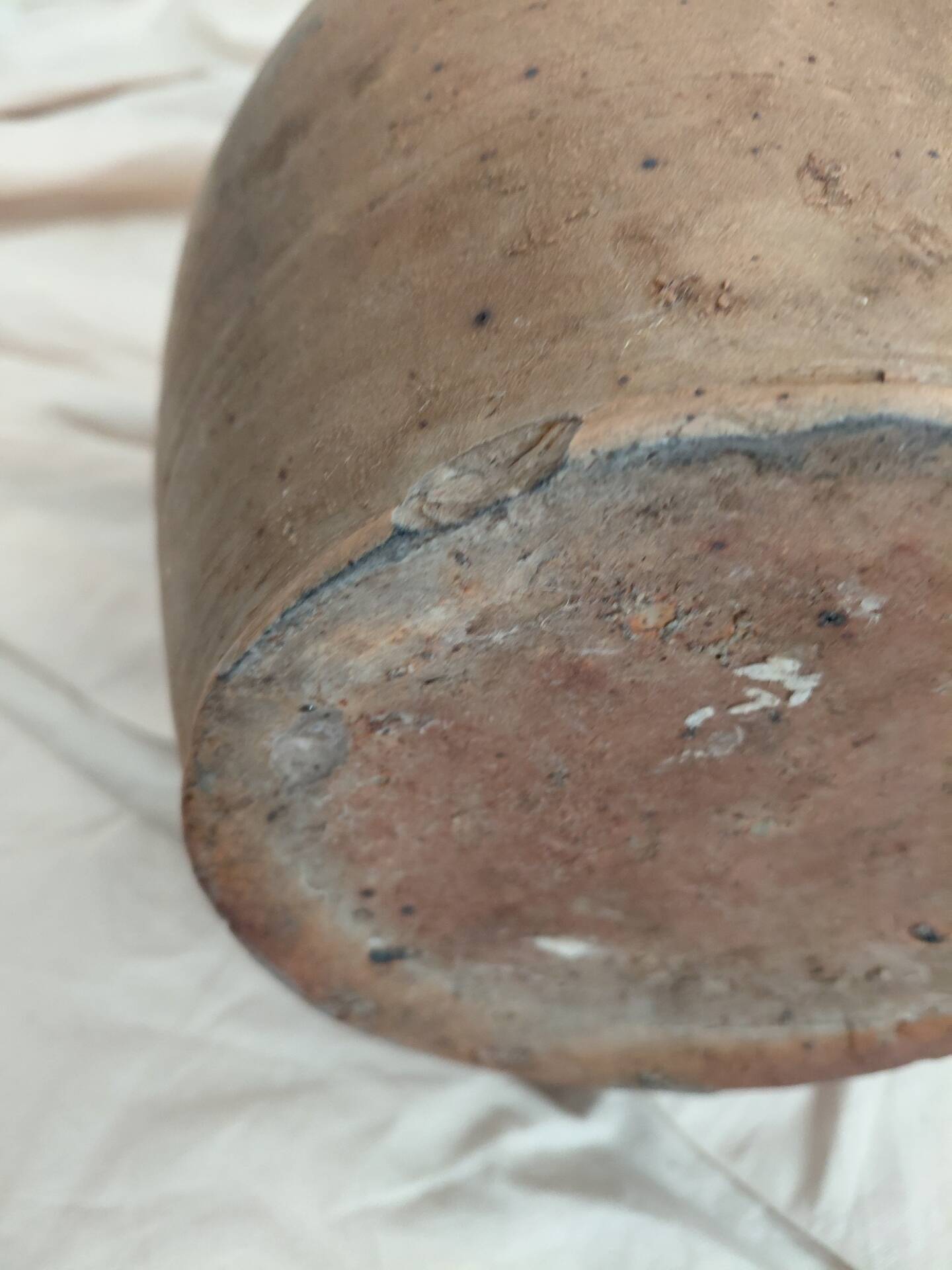 Old farm jug in glazed stoneware
