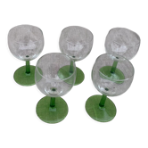 5 transparent glass glasses and green glass vase go