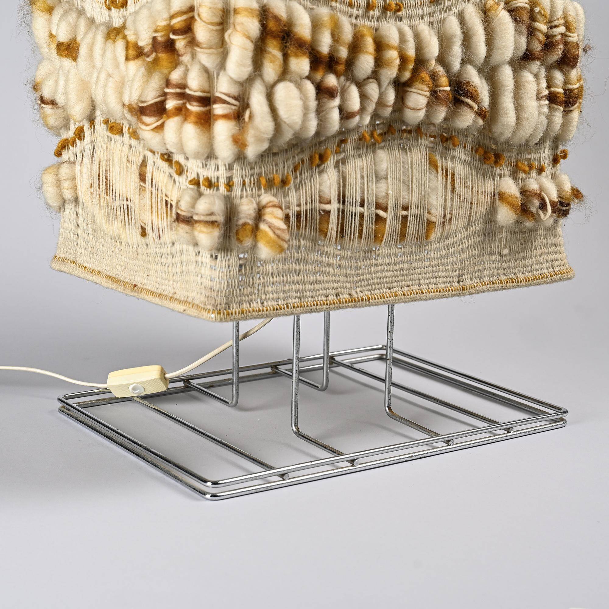 Woven textile and chrome metal table lamp by Max Sauze, circa 1970.