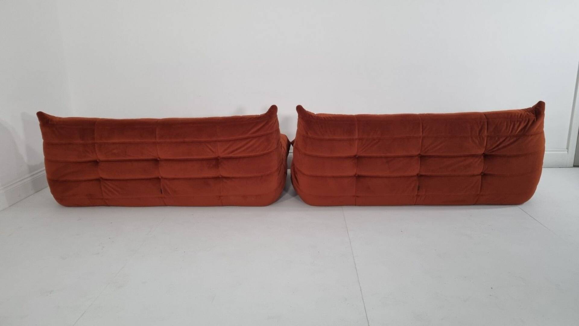 Ligne Roset Pair of 3-seater Togo sofas in rust velvet