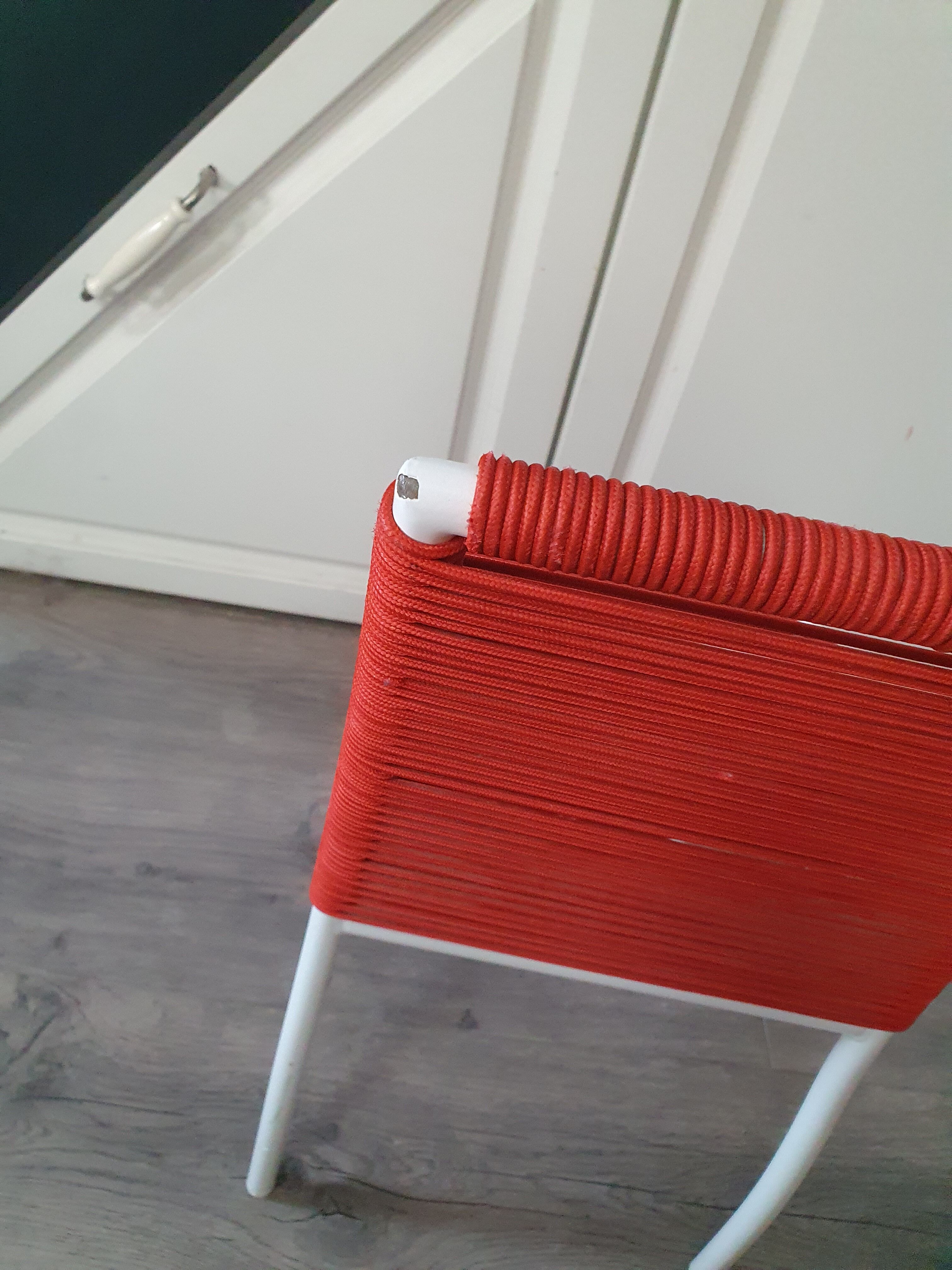 Vintage children's chair in white matel (some splinters of paint) with red scoubidou rope year 70