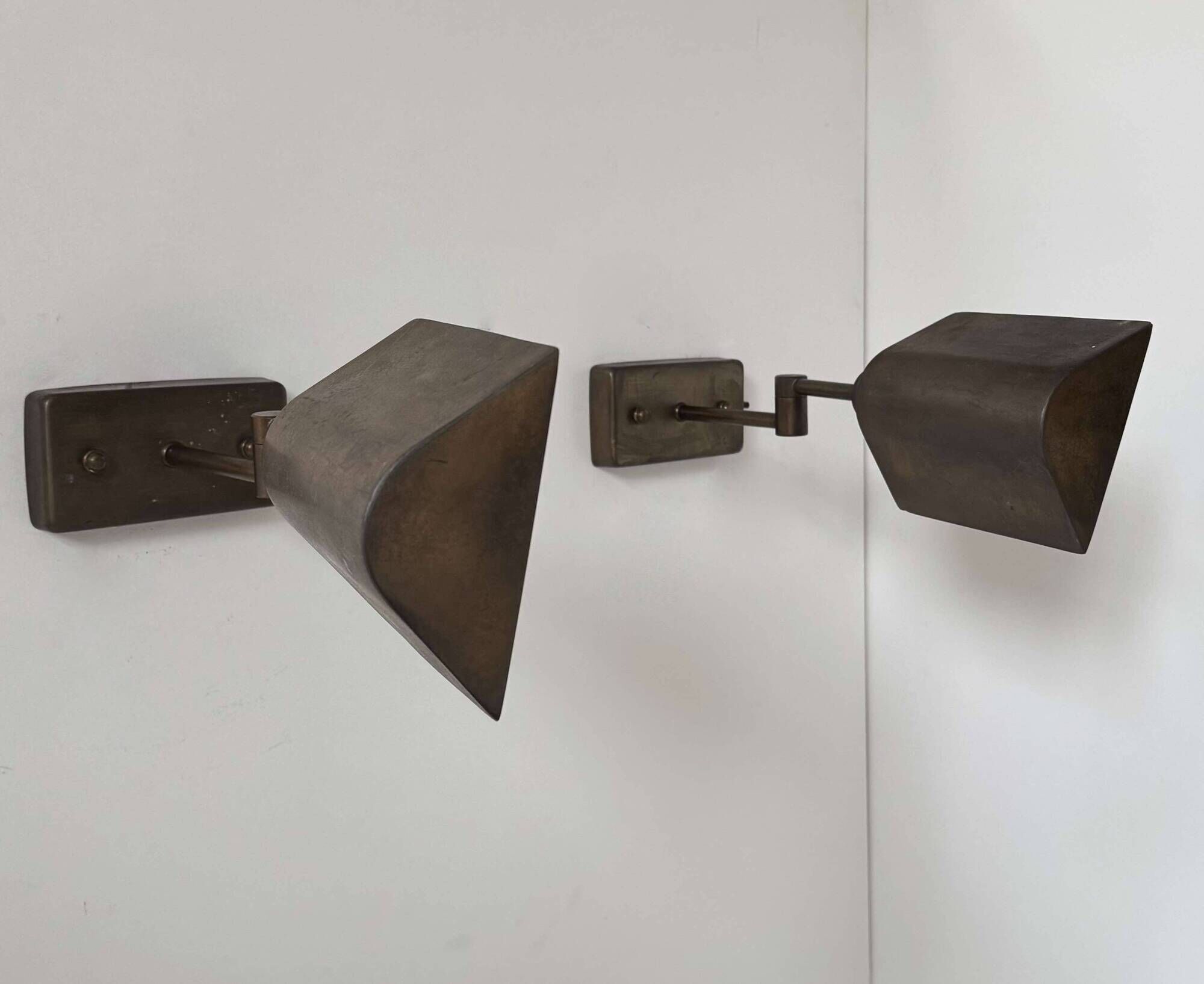 Pair of vintage adjustable wall lights, patinated brass, France 1970.