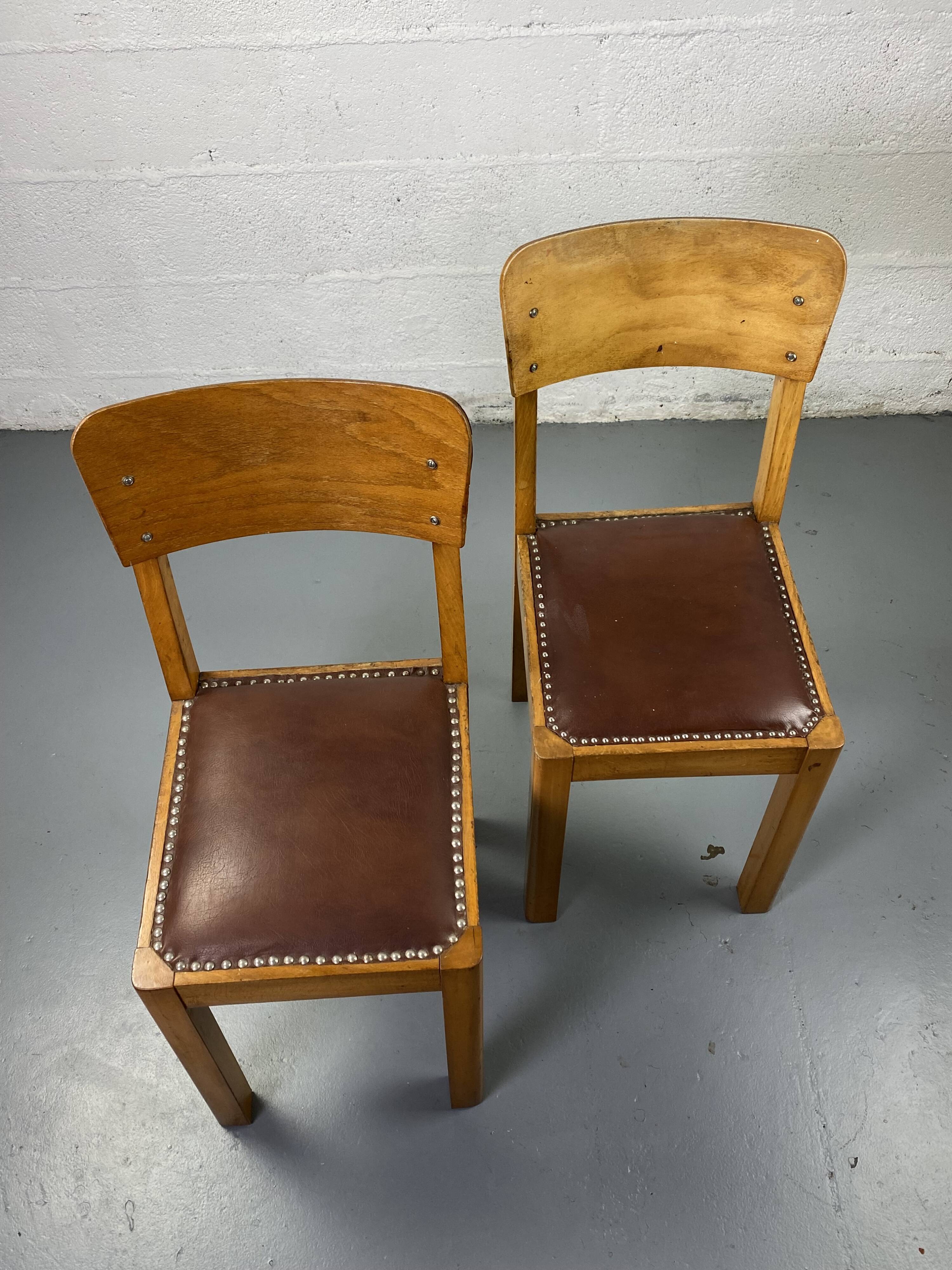 Pair of wooden and leather chairs