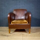 Antique club armchair of leather cloth