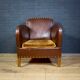 Antique club armchair of leather cloth
