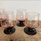 4 pink glasses with black stems