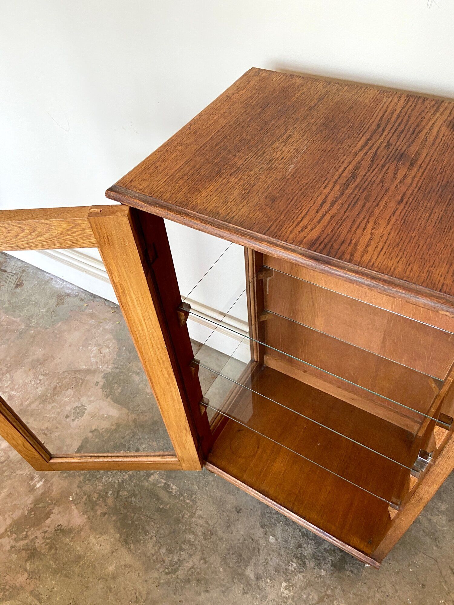 Dark wood display case and transparent glass