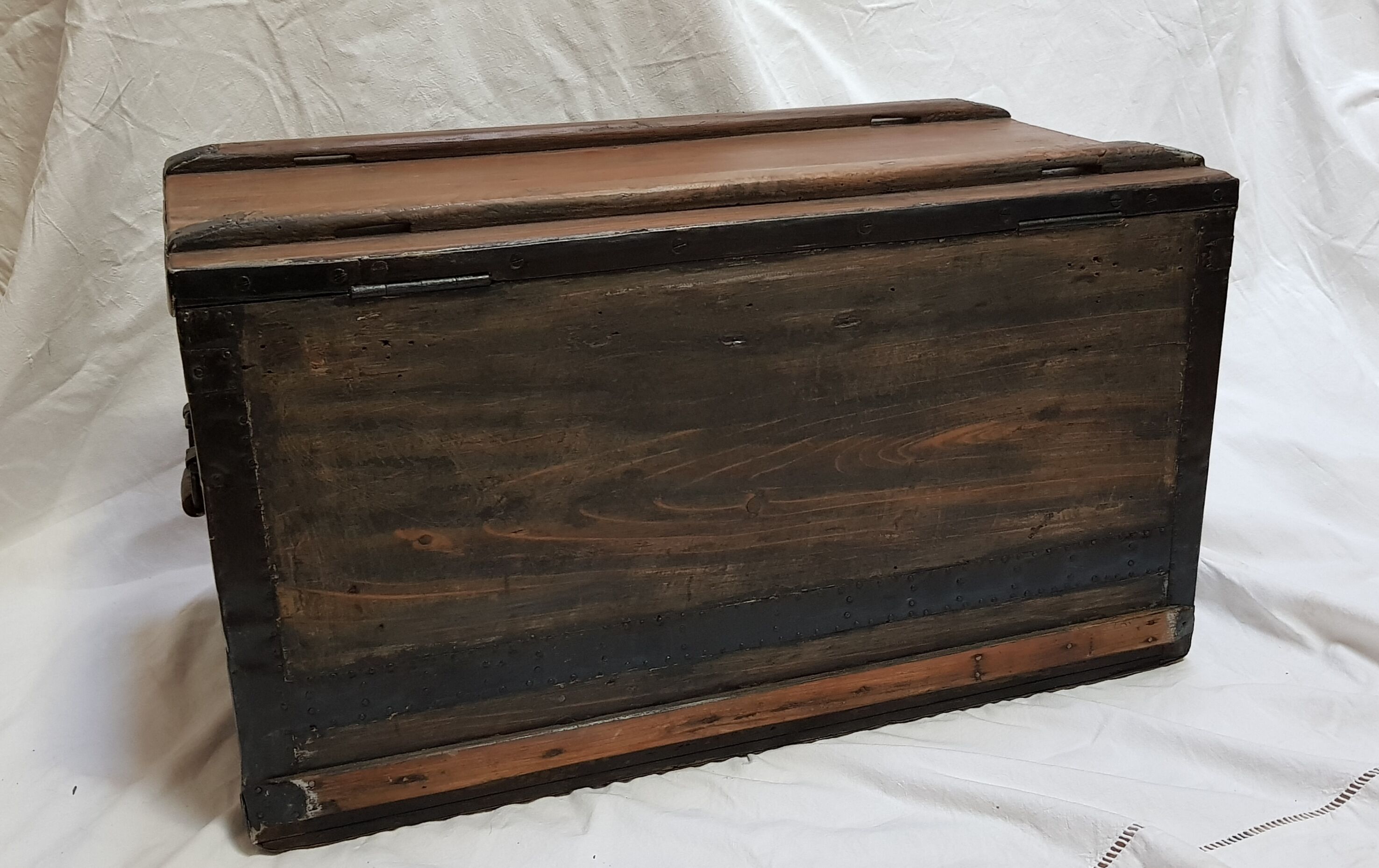 Former wooden travel trunk