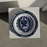 Artesania Alvarez Spanish plate in terracotta with blue plant motif.