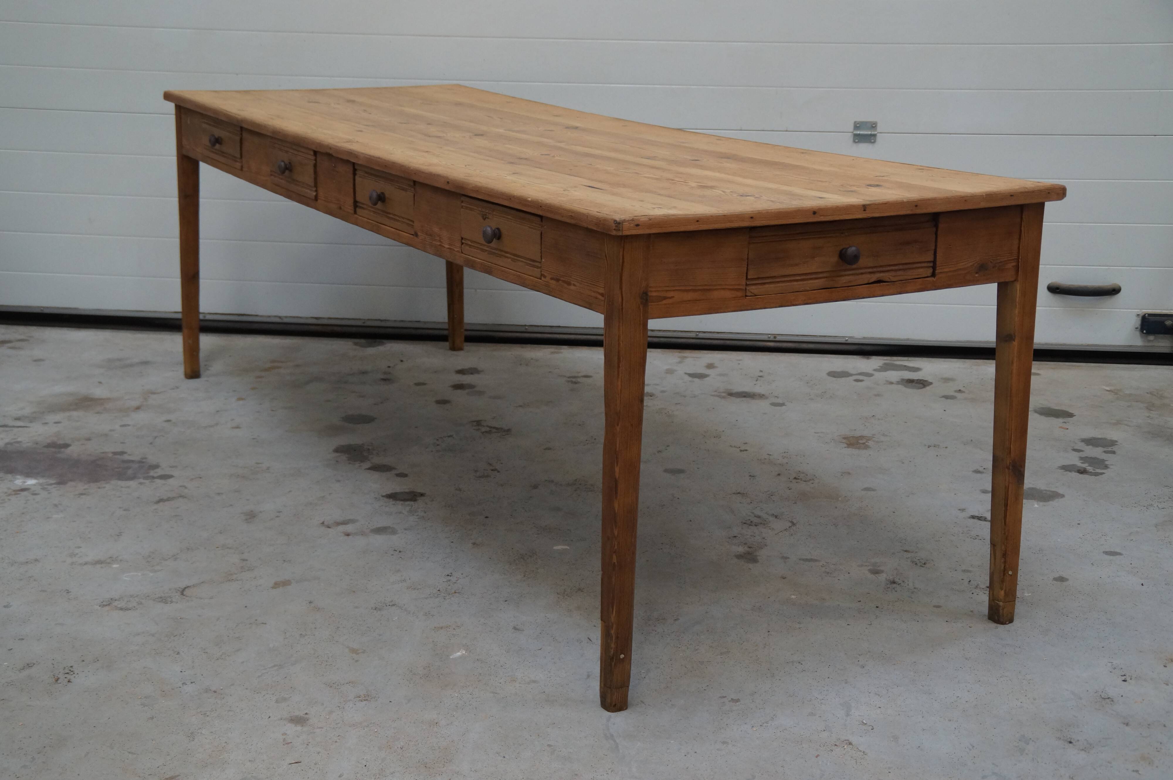 Old canteen in pine table