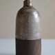 Ceramic bottle vase with a fish signature to be identified.