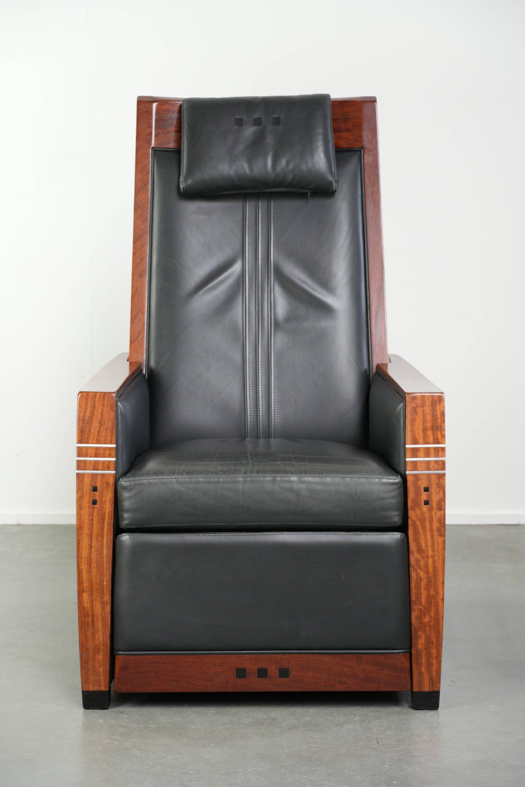 Electrically adjustable Art Deco design recliner with black cowhide leather