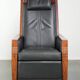 Electrically adjustable Art Deco design recliner with black cowhide leather
