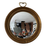 Vintage witch's eye mirror in gilded wood