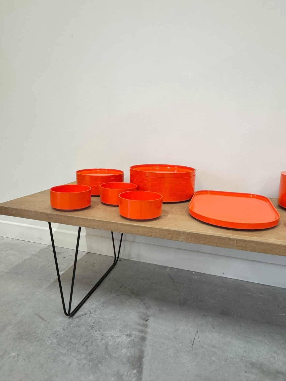 Vintage “Max” orange plastic dinnerware set 1964