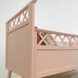 Vintage old pink wooden baby bed