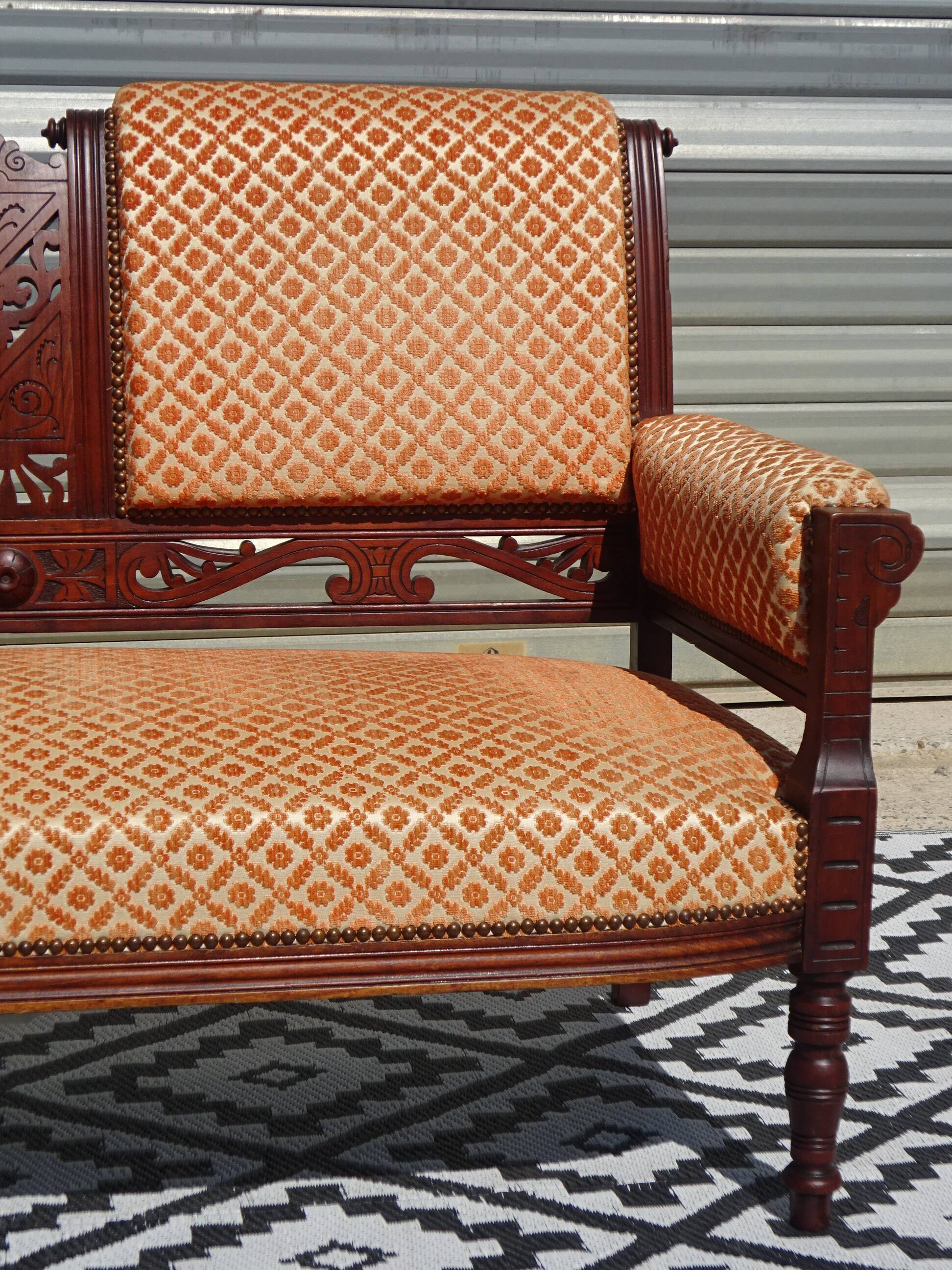 Vintage bench in wood and orange/ivory velvet.