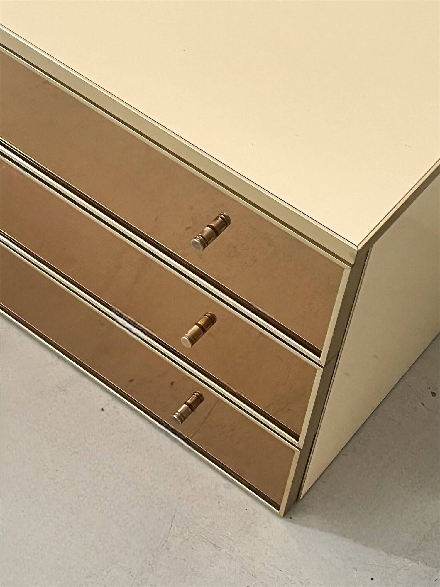 Low ivory lacquered enfilade, smoked mirror & brass JC Mahey, design 1970.