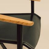 Maërl armchair, Galathée model, black leather, solid wood armrests of your choice