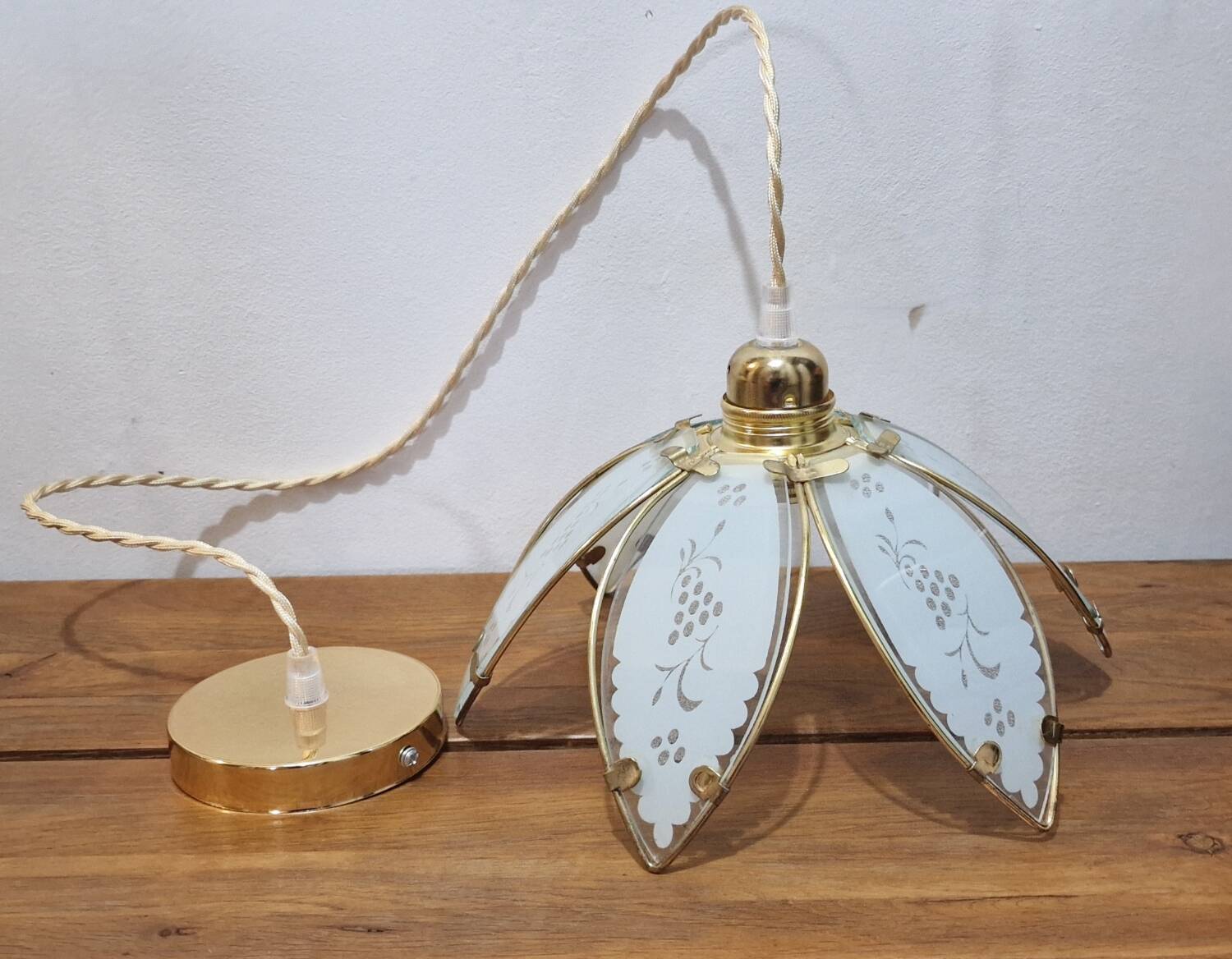 Glass flower rimmed with brass