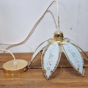 Glass flower rimmed with brass