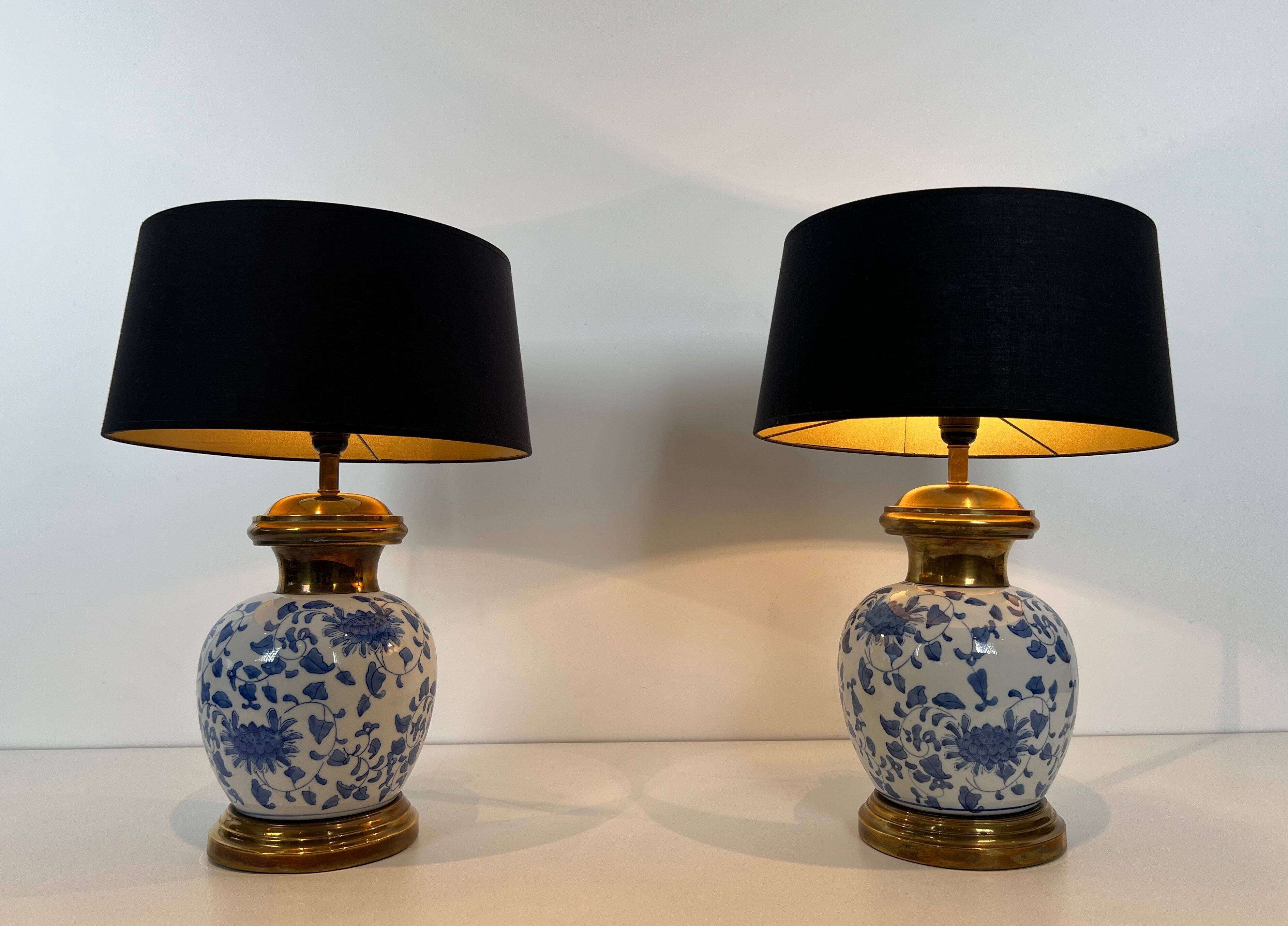 Pair of porcelain lamps with Chinese-style decorations and brass.