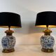 Pair of porcelain lamps with Chinese-style decorations and brass.