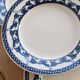 6 vintage flat plates with a blue and white goose pattern.