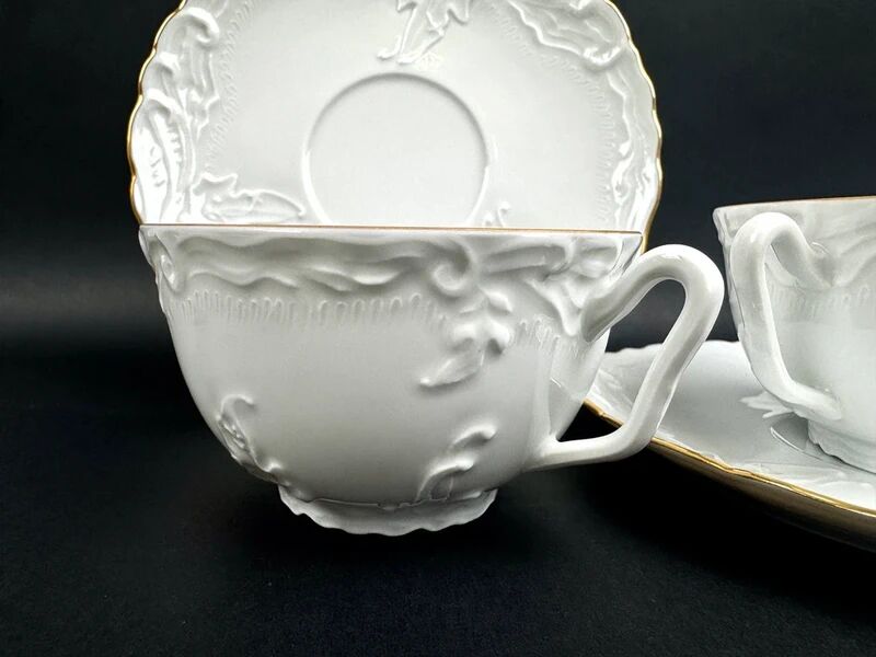 Tharaud Limoges white porcelain cups and saucers with gold relief