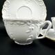 Tharaud Limoges white porcelain cups and saucers with gold relief