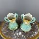 Pair of Art Nouveau vases in glazed ceramic with floral decoration, 20th Century