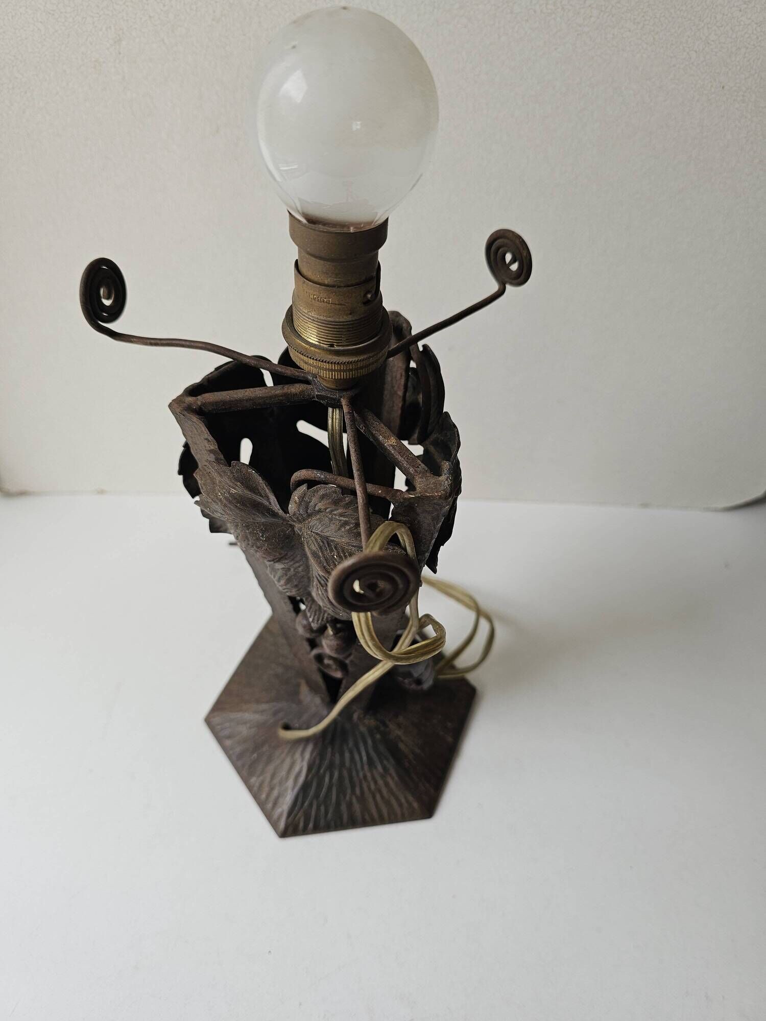 Antique lamp base in wrought iron with leaf motif in Art Deco style from the 1930s.