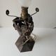Antique lamp base in wrought iron with leaf motif in Art Deco style from the 1930s.