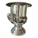 Silver metal champagne bucket.