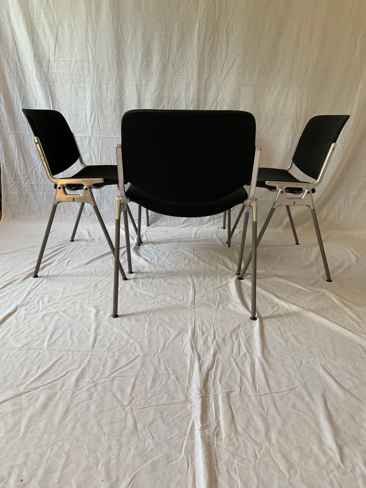 A set of four Castelli DSC 106 chairs, designed by G. Piretti, Italy, 90s