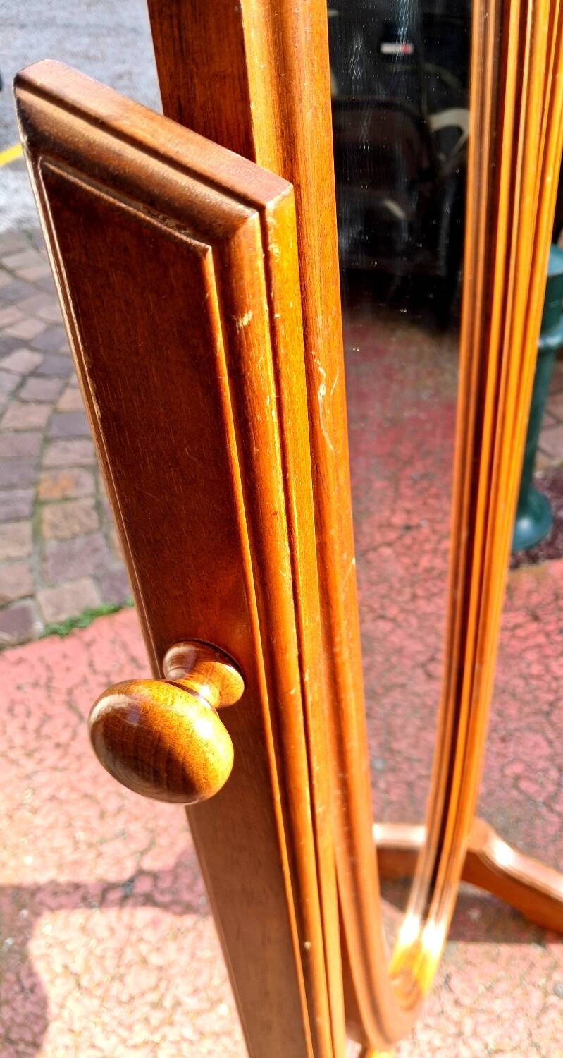 Adjustable full-length mirror for dressing room.