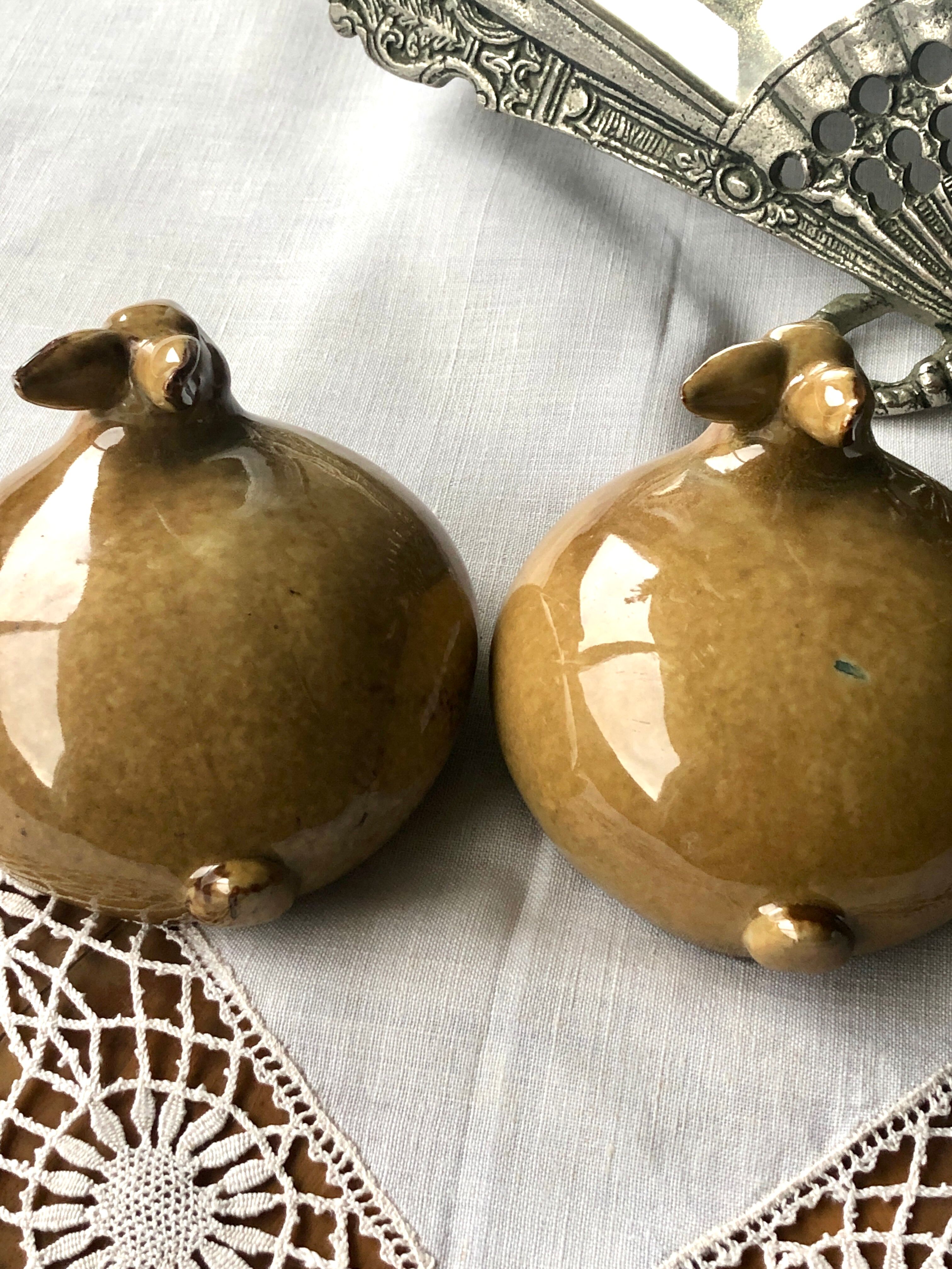 Glazed stoneware rabbits