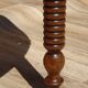 Walnut drop-leaf table with honey spoon legs.