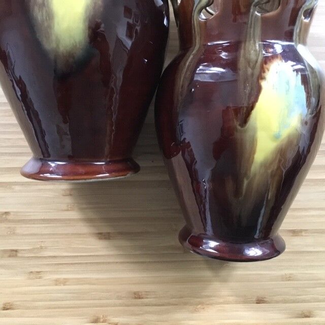 Pair of flaming ceramic vases