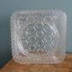 Square globe ceiling light in moulded glass.