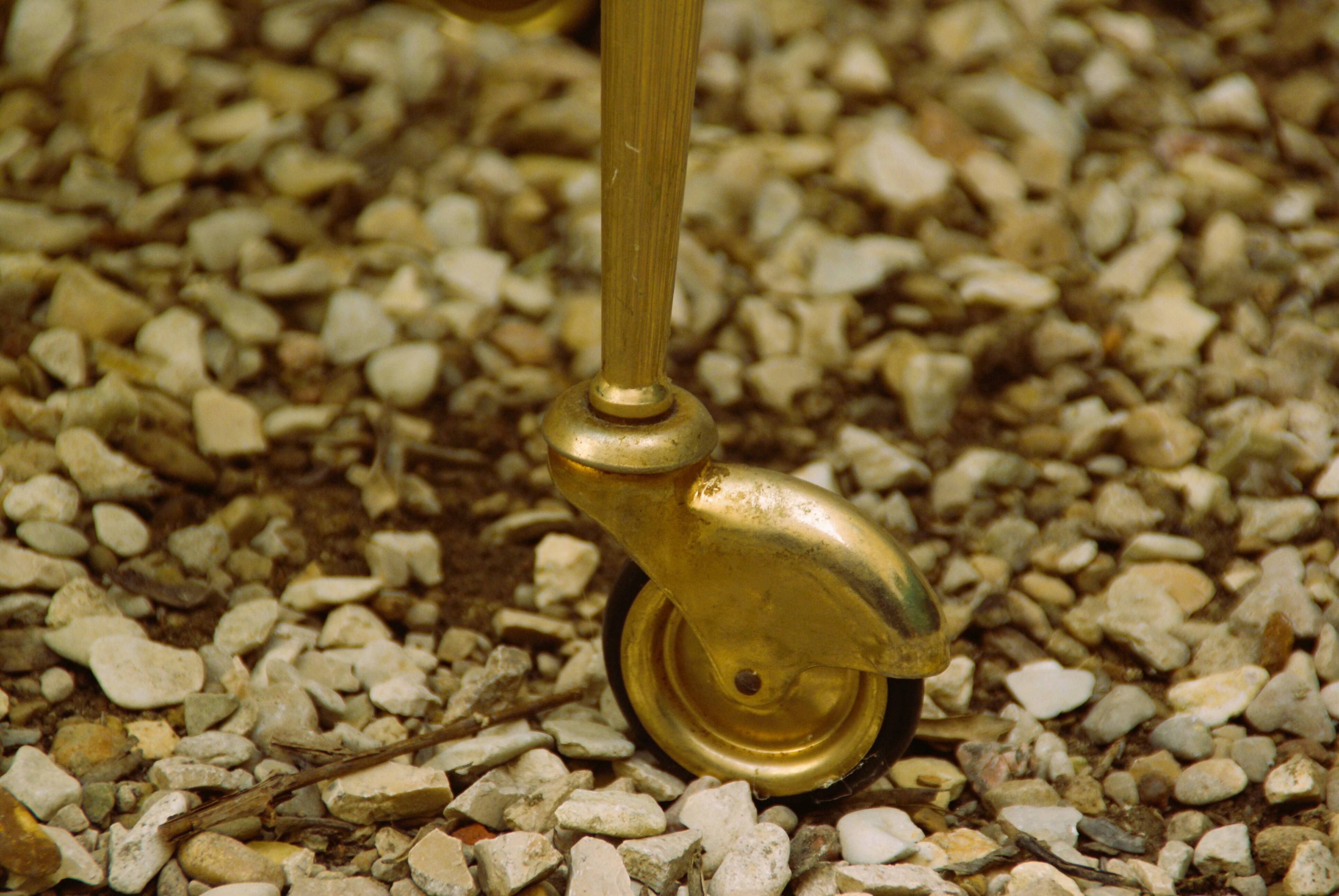 Antique brass serving trolley with smoked glass top, Louis XVI style.