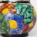 Multicolored Vallauris vase in polychrome earthenware with bas-relief decoration of colored flowers