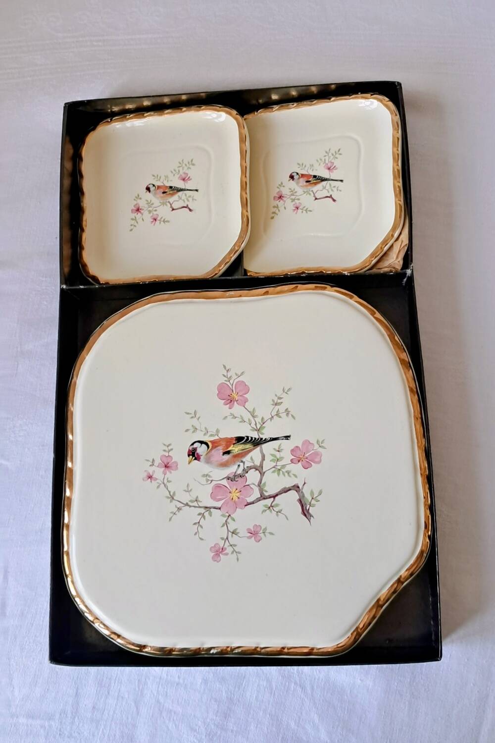 Trivet and bottle holder Salin, 1950s. Bird on branch.