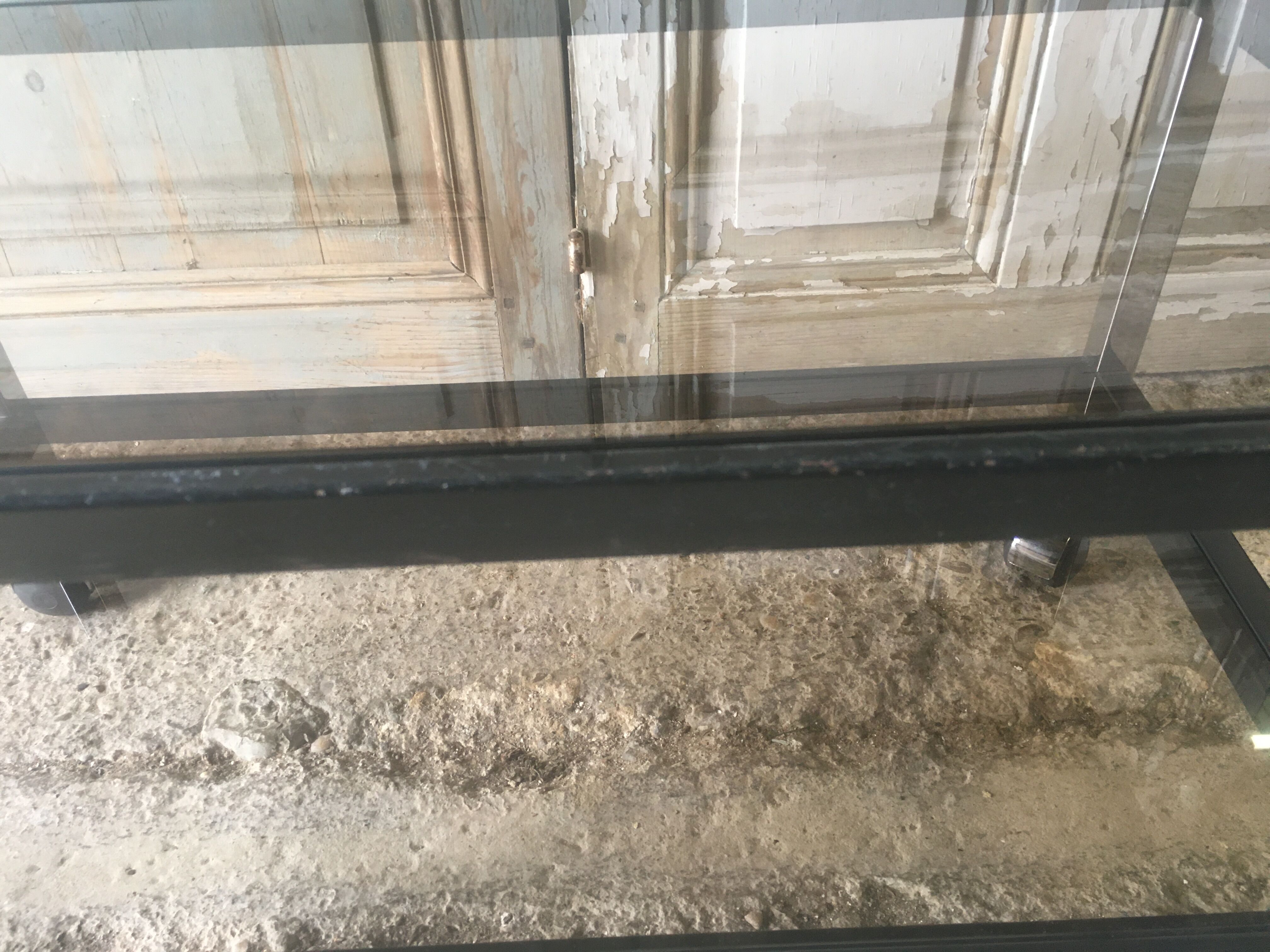 Metal coffee table with smoked glass.