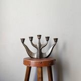 Vintage bronze candlestick chandelier in contemporary Scandinavian design.