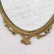 Miroir ovale ancien type médaillon sur cadre laiton
