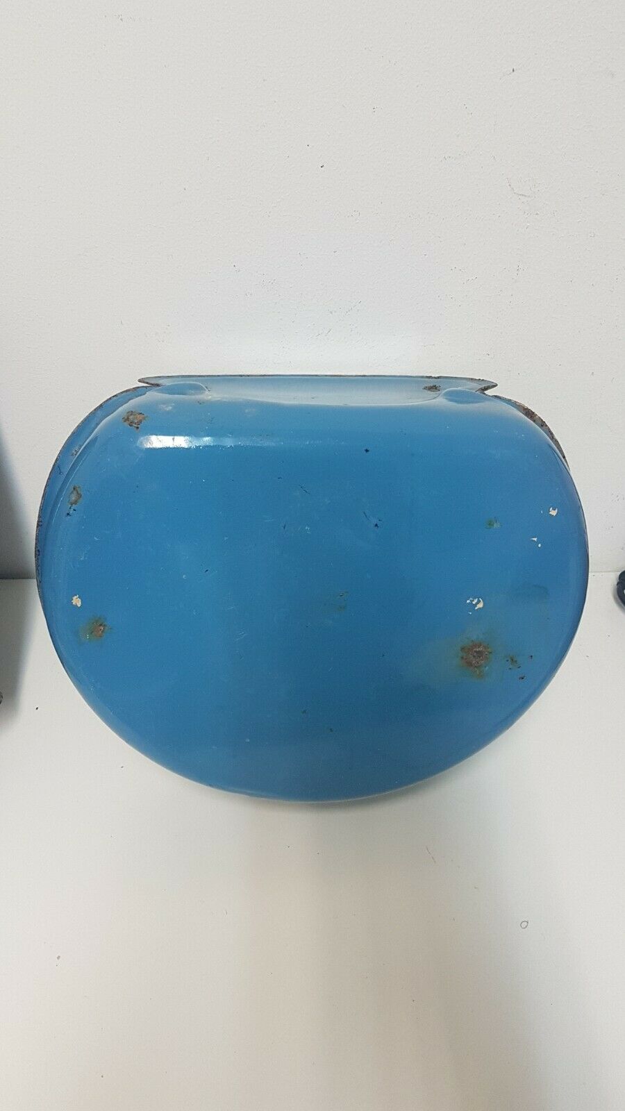 Old hands wash in enamelled sheet metal