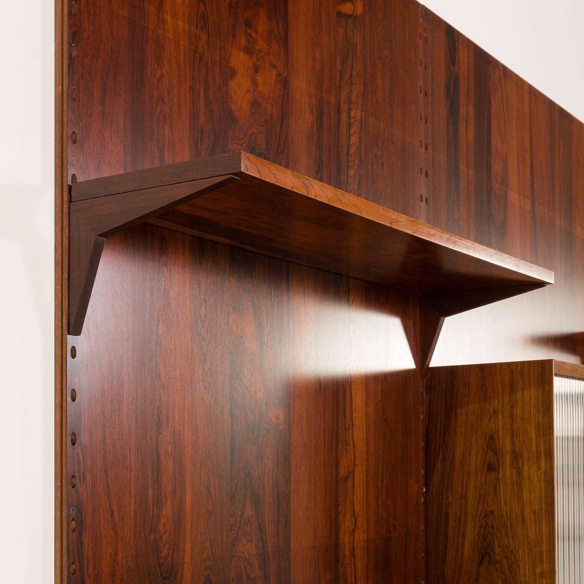 Poul Cadovius rosewood wall unit on panels for Cado, Denmark 1960s
